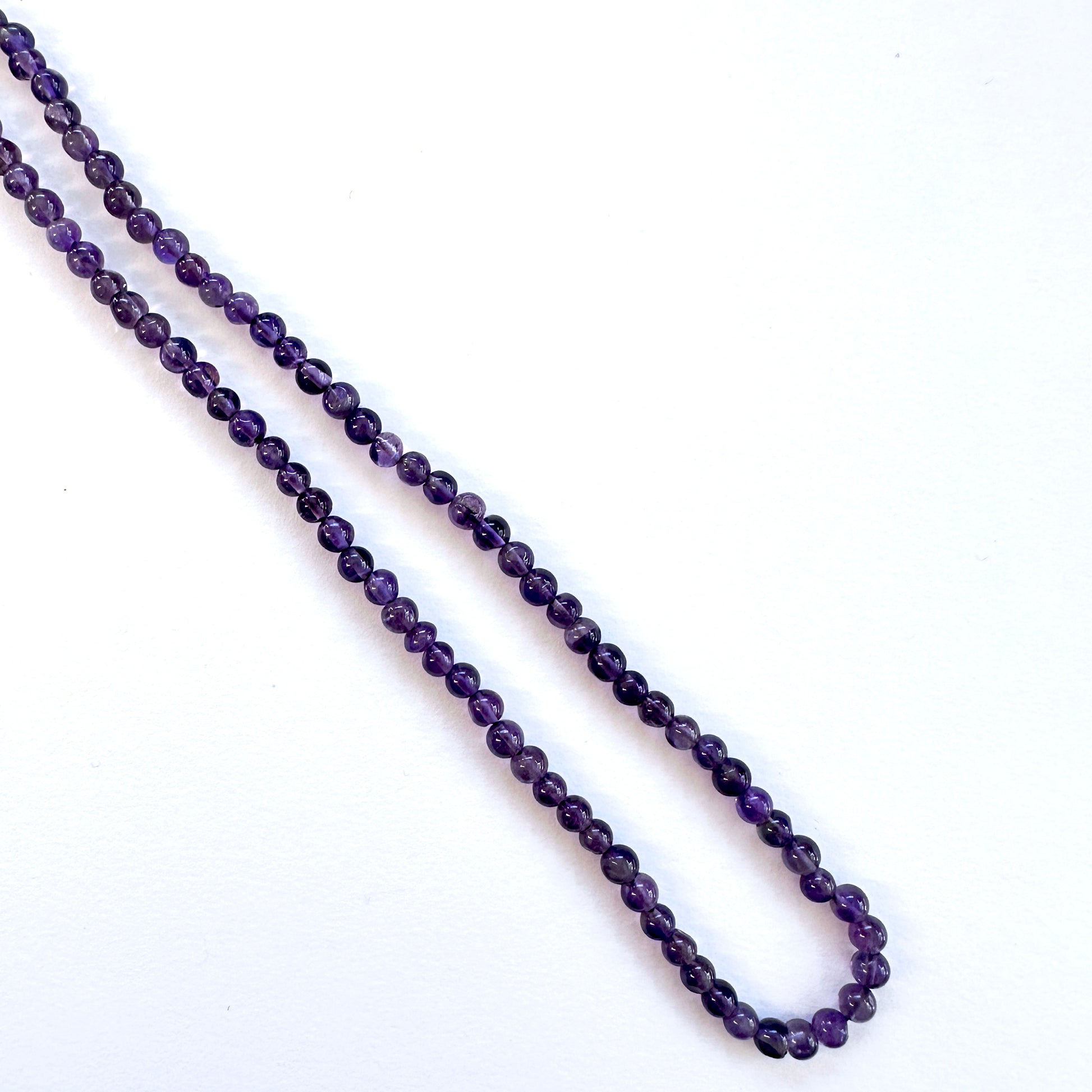 Amethyst stone beads with smooth round cut and rich colour saturation.