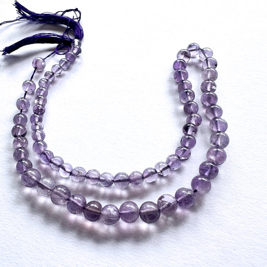Natural gemstone beads featuring Amethyst with polished finish and consistent round cut.