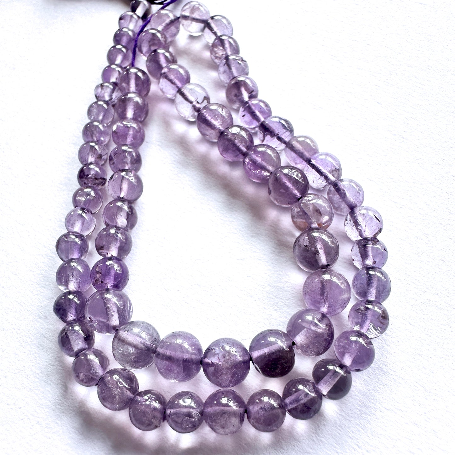 Handmade jewellery components made from 4.5-6mm Amethyst beads with 0.5mm drilled holes.