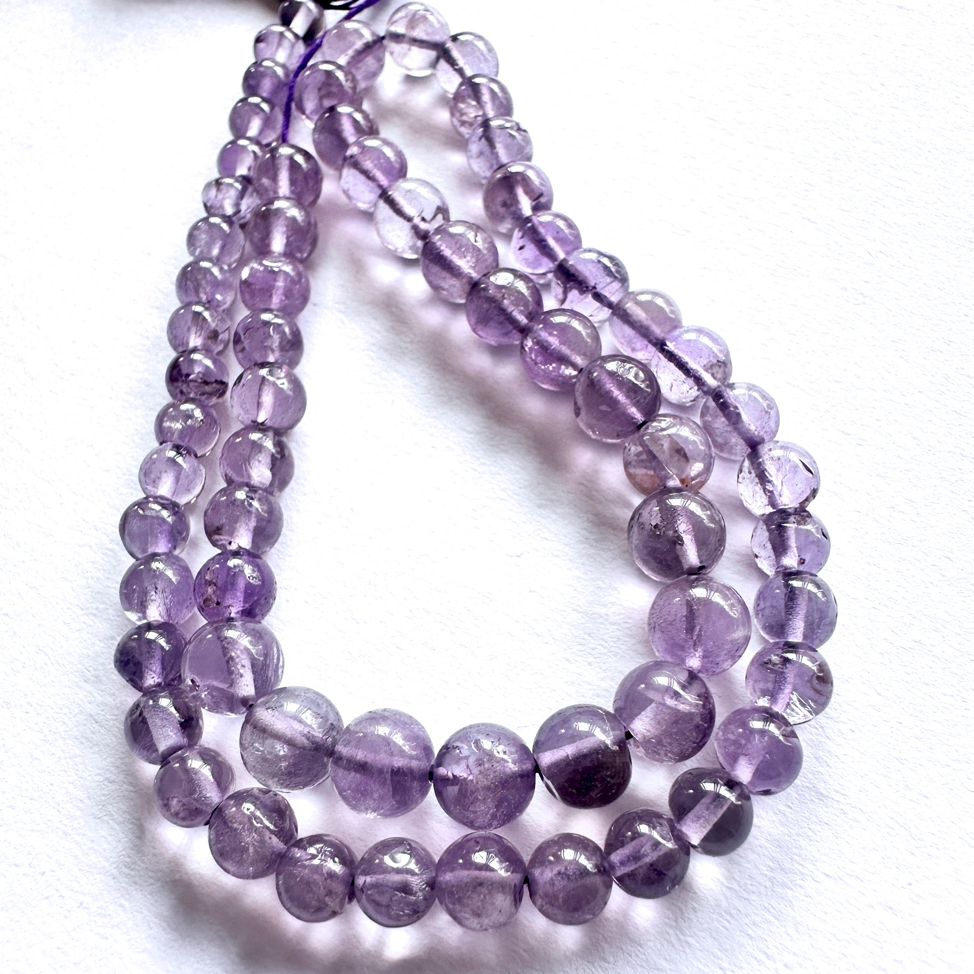 Handmade jewellery components made from 4.5-6mm Amethyst beads with 0.5mm drilled holes.