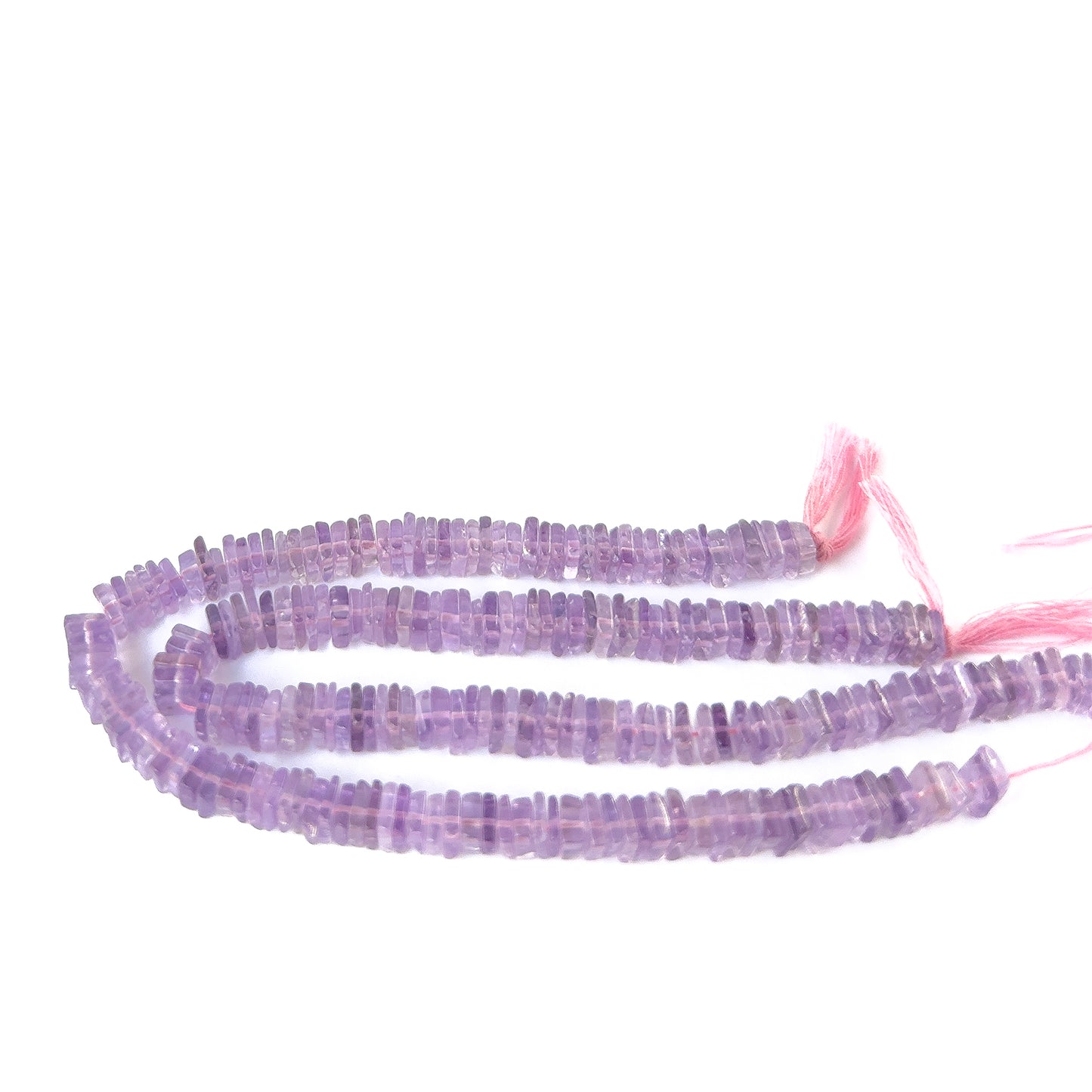 Premium Amethyst heishi beads showcasing polished surfaces and natural violet colour for artisan designs.