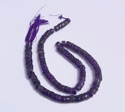 Natural Amethyst stone beads arranged in strands with glossy surface and shine.