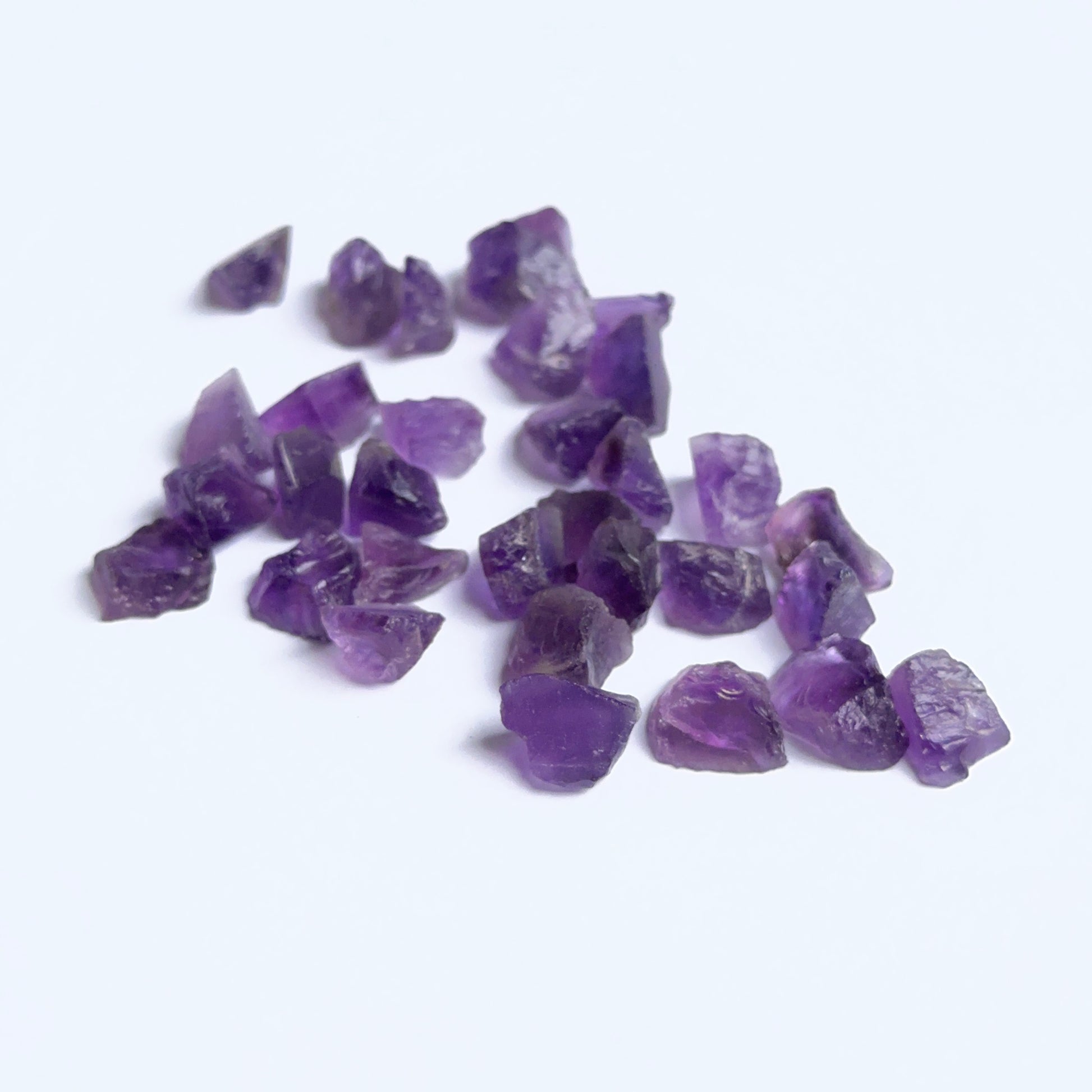 Raw amethyst pieces displayed with visible crystalline texture perfect for natural stone bead crafting.