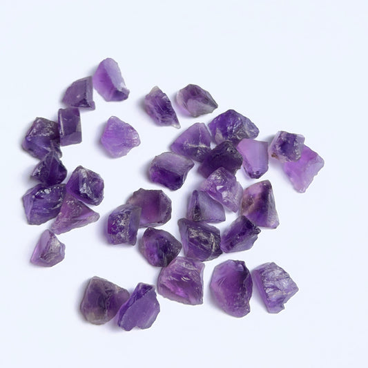 Amethyst rough stones arranged to showcase natural gemstone quality for DIY jewellery making.