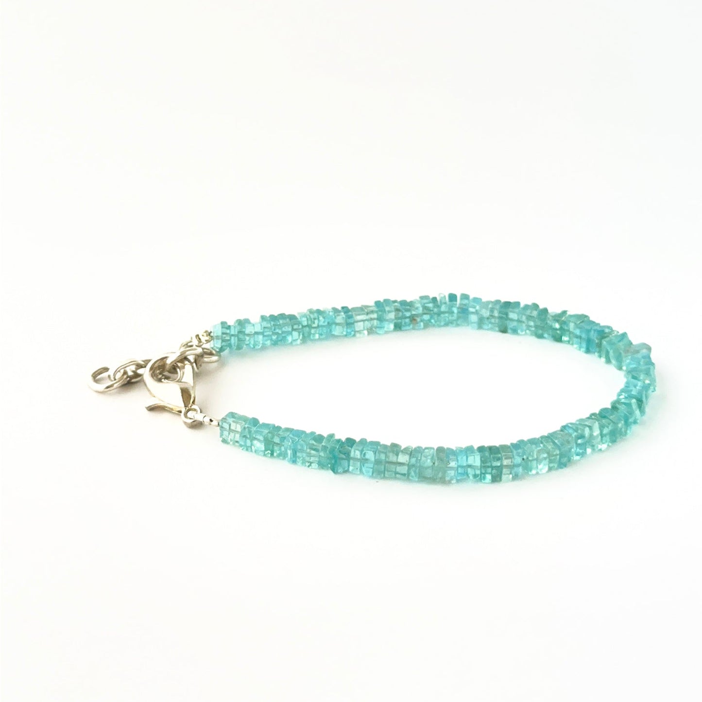 Square heishi apatite bead bracelet crafted in a classic 18cm adjustable style.