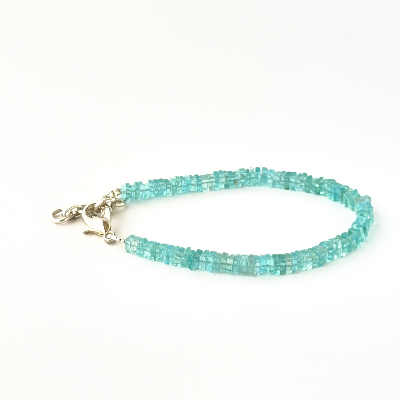 Square heishi apatite bead bracelet crafted in a classic 18cm adjustable style.