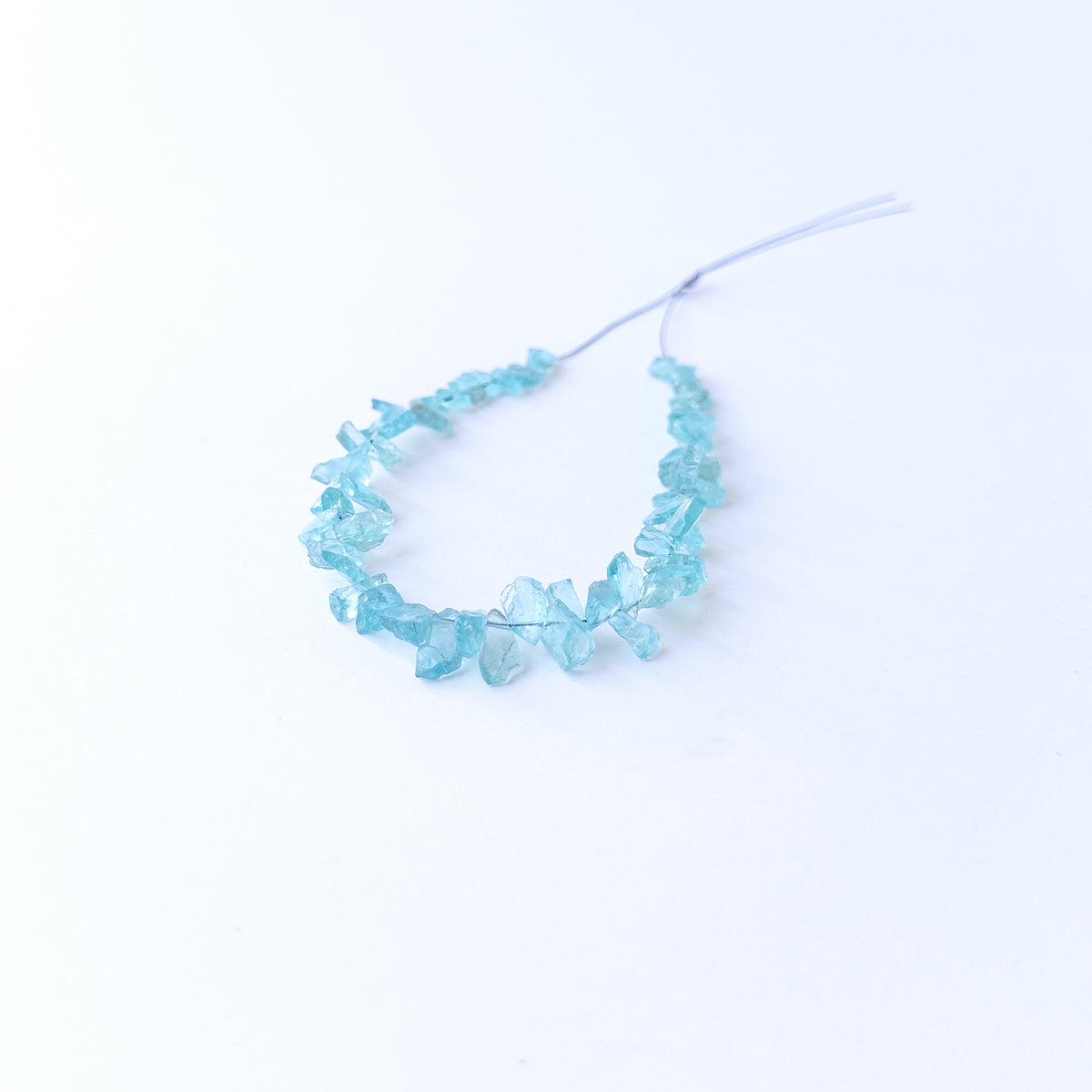 Raw Apatite drilled rough beads in assorted 4–5mm sizes for artisan jewellery designs.