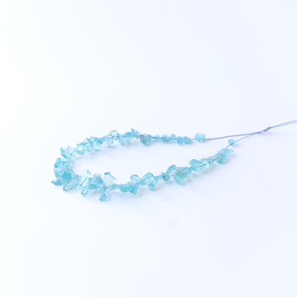 High‑quality Apatite gemstone beads with natural rough surfaces and bright ocean‑blue colour.