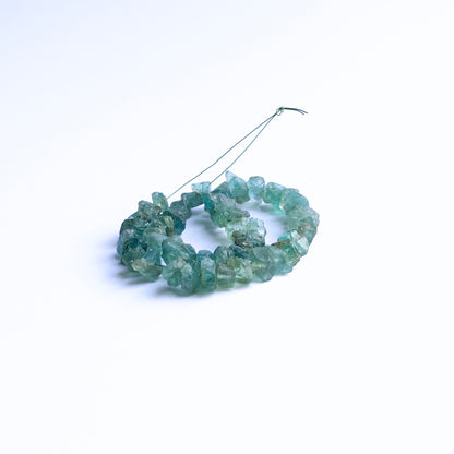 High‑quality Apatite rough beads displaying bold ocean‑blue hues and organic crystal form.