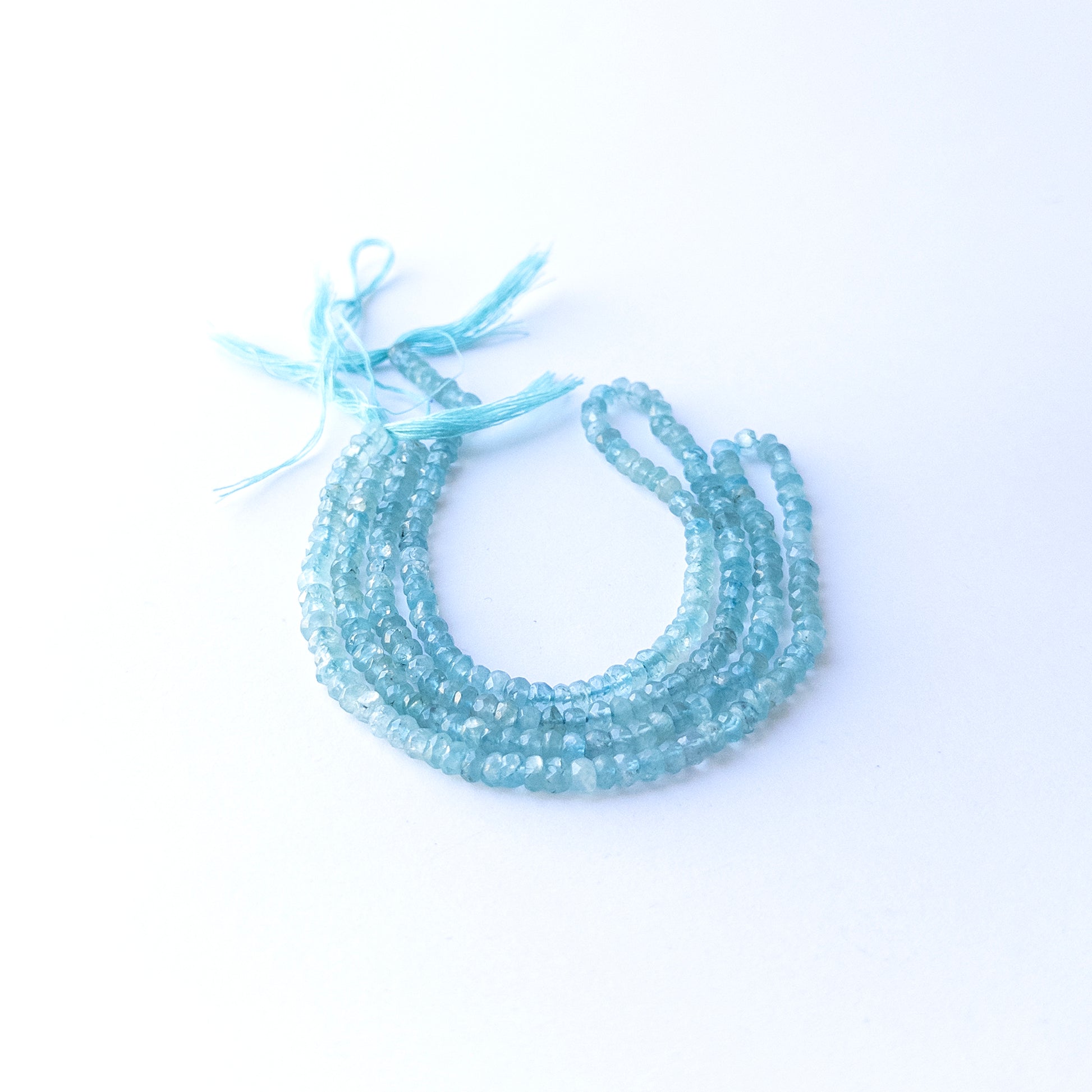 Apatite faceted rondelle beads in 4.3mm size on a 32cm strand, showcasing bright blue sparkle for handmade jewellery.