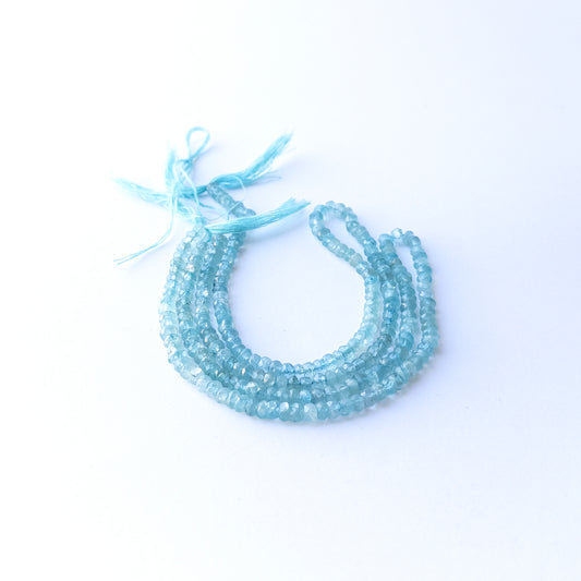 Apatite faceted rondelle beads in 4.3mm size on a 32cm strand, showcasing bright blue sparkle for handmade jewellery.