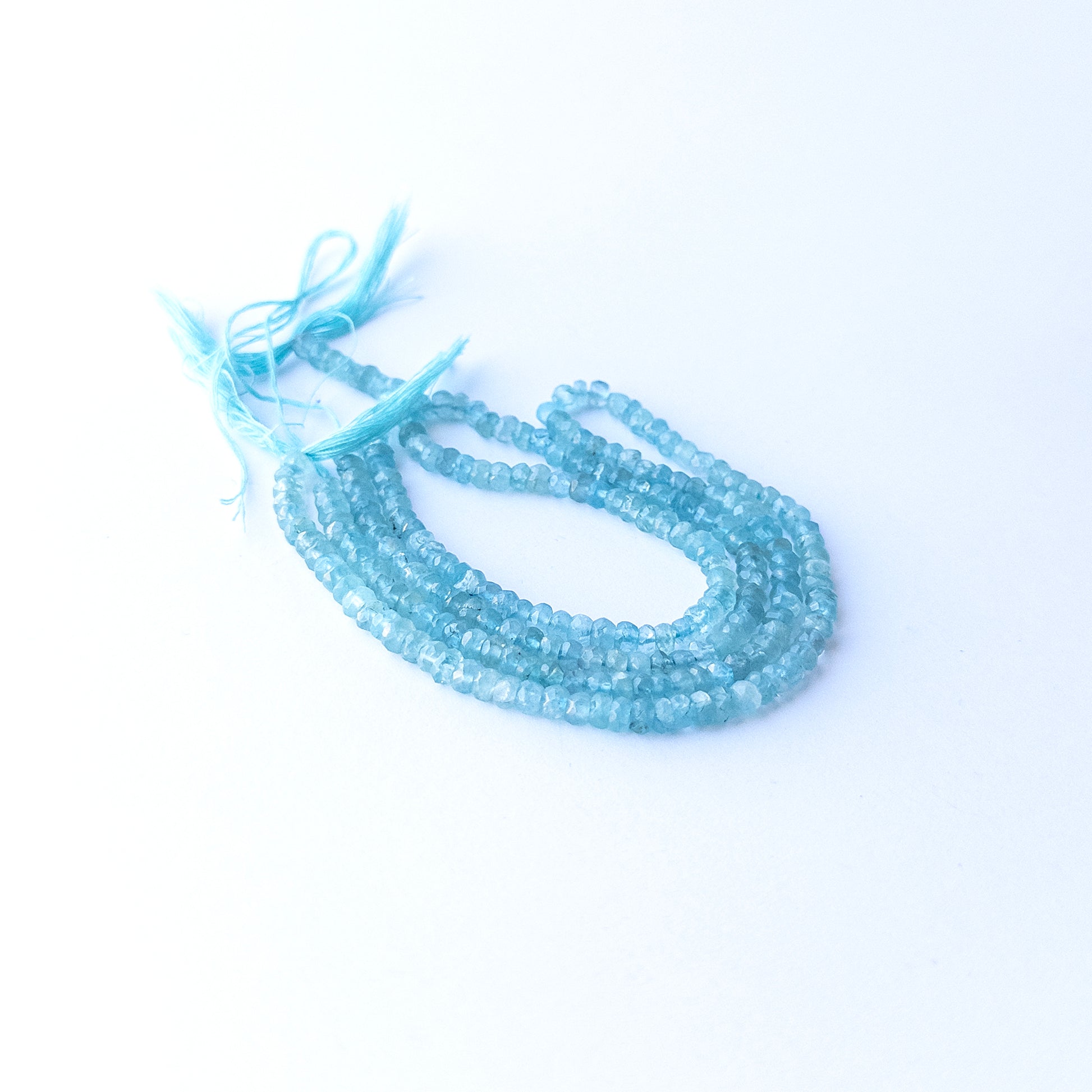Authentic Apatite stone beads with faceted rondelle cut, ideal for DIY jewellery makers seeking premium gemstone components.