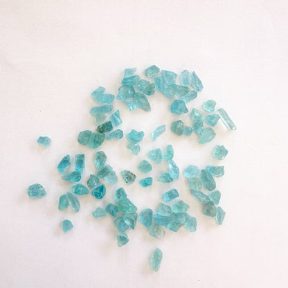 A dial gauge measures the Apatite rough cut 4.5mm gemstone.