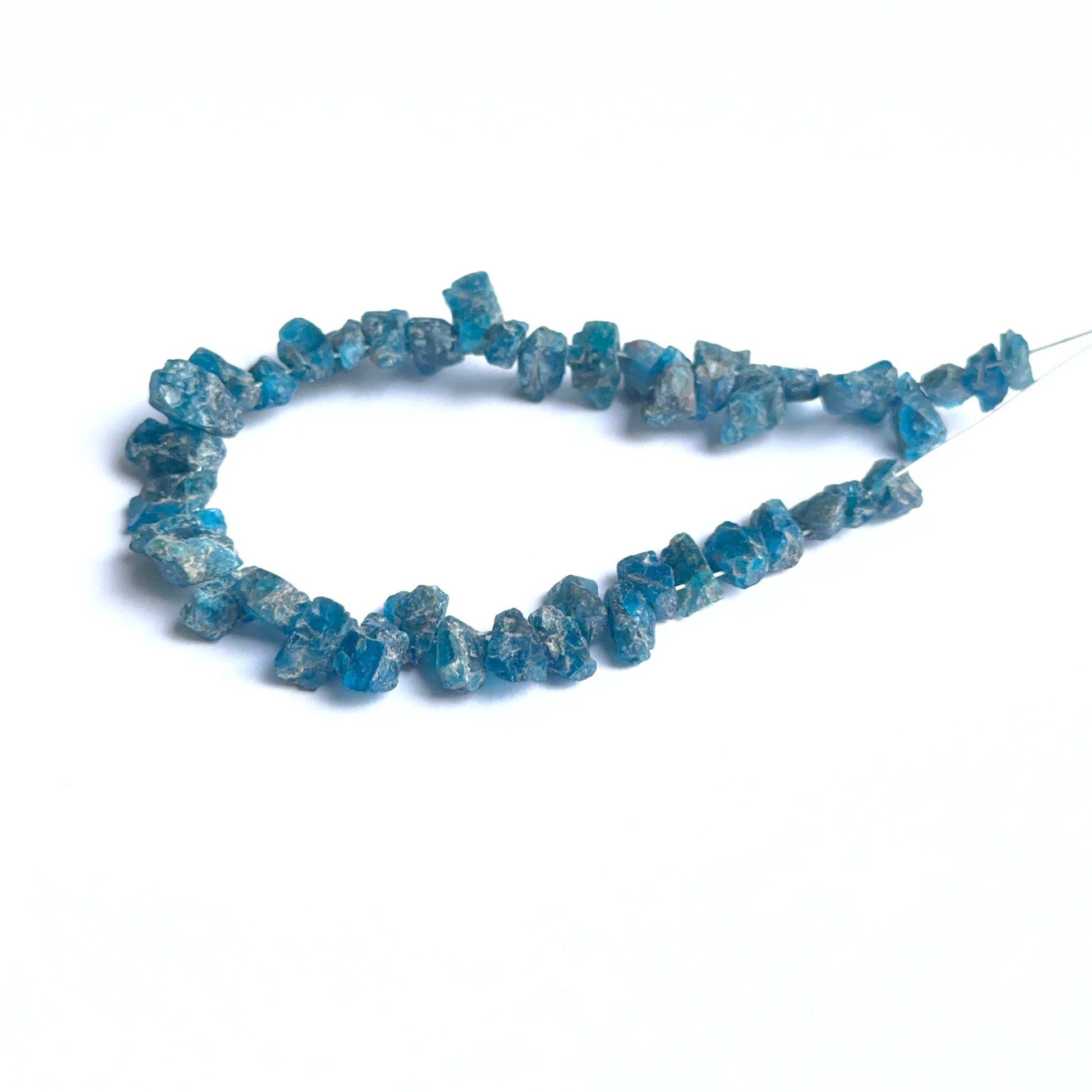 Apatite rough stones arranged neatly to showcase natural gemstone quality and handcrafted appeal.