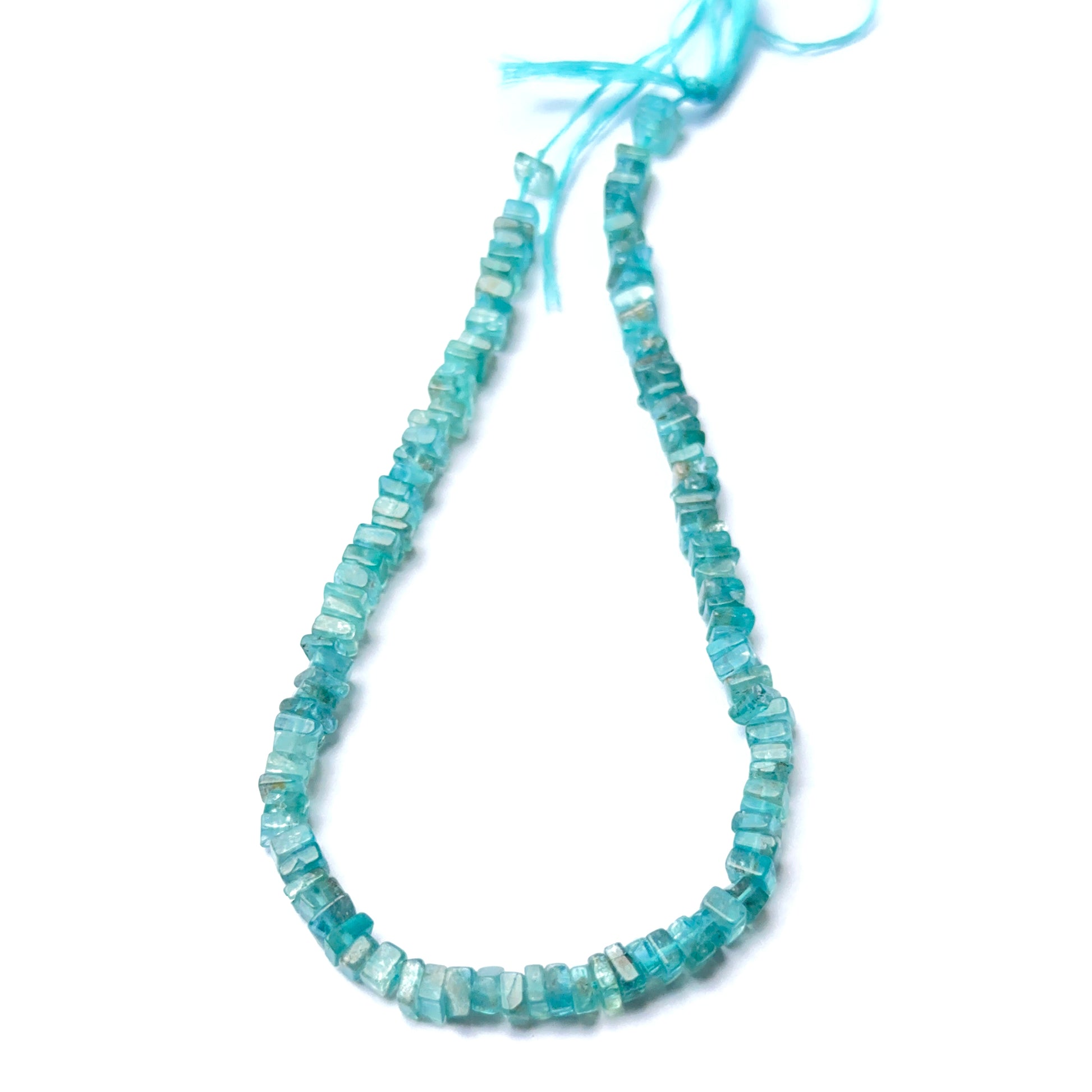 Vibrant Apatite stone beads in smooth heishi cut, displaying ocean‑blue tones for jewellery designers.