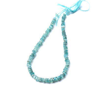 Close‑up of Apatite stone beads in smooth heishi cut, highlighting polished finish and vibrant colour for handmade jewellery components.