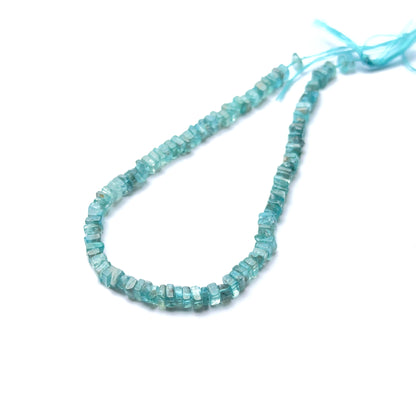 Apatite 4.1–4.3mm smooth heishi beads arranged on a strand, showing clarity, shine and coastal‑blue hues.