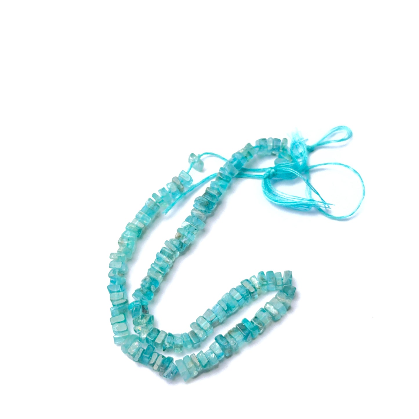 Apatite natural gemstone beads in smooth heishi shape, ideal for artisan jewellery and creative DIY beadwork.