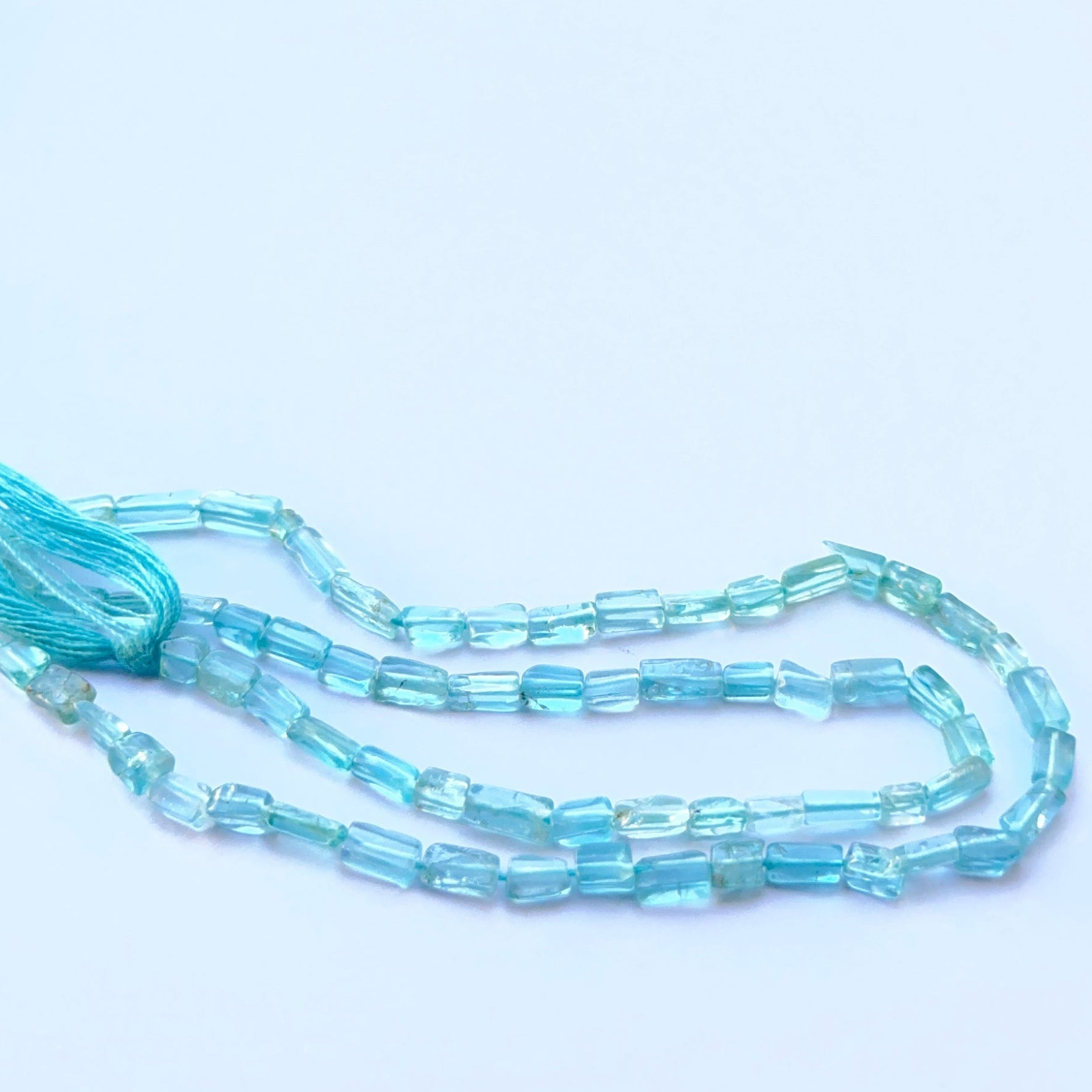 Detailed view of premium Apatite stone beads showing uniform shape, soft shine and high‑quality finish.