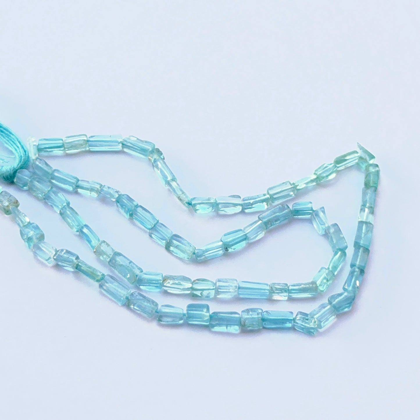 Apatite smooth rectangle natural gemstone beads in soft blue‑green tones arranged on a 34cm strand for handmade jewellery components.