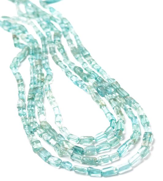 Apatite smooth rectangle heishi beads sized 3.3–3.5mm arranged in a 33cm strand, showing vivid blue‑green tones and a polished finish.
