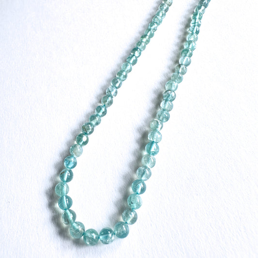 Natural gemstone beads featuring Apatite with polished finish and consistent round cut.