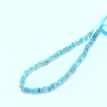 Apatite smooth square Heishi beads aligned on a strand highlighting colour depth, uniformity and high‑quality craftsmanship.