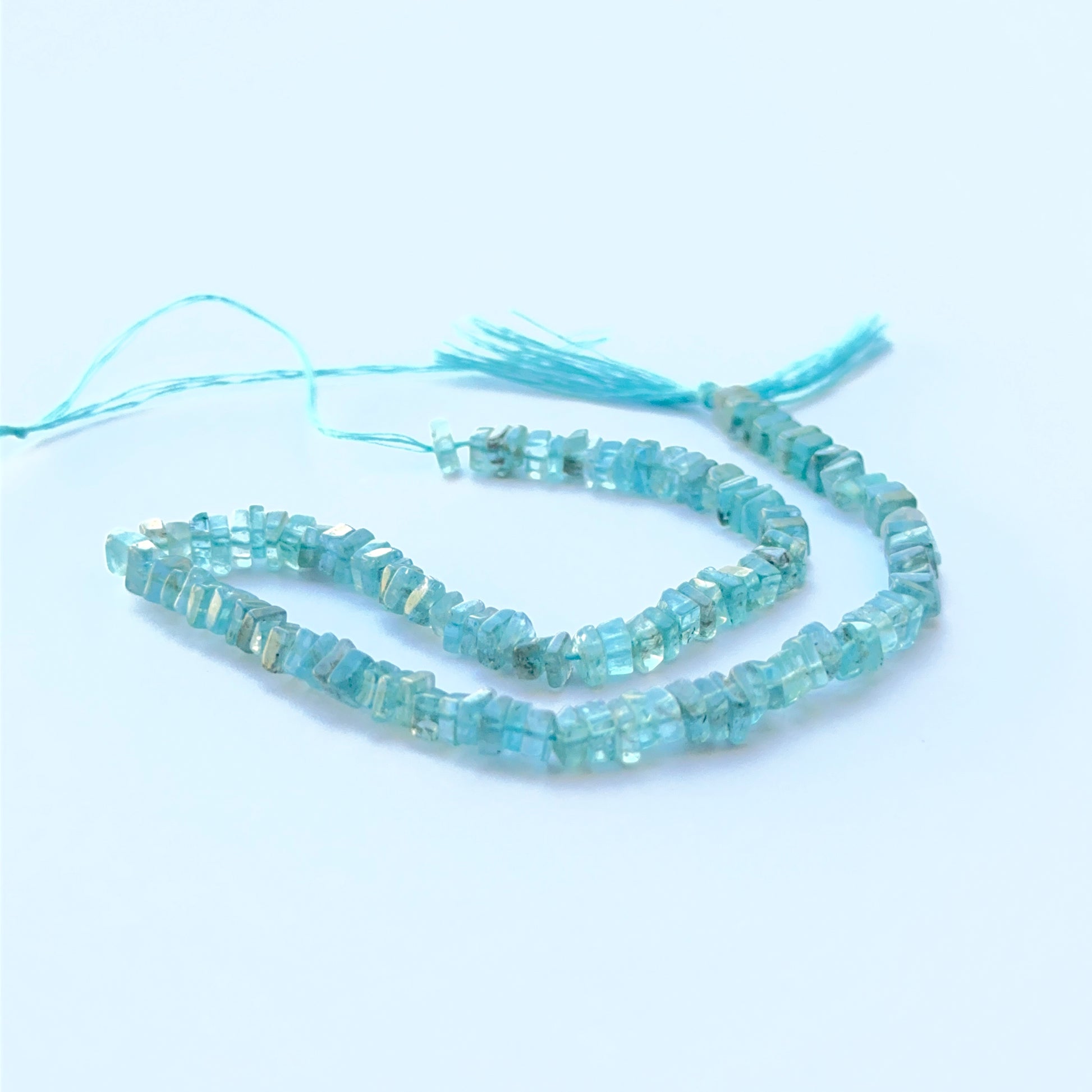 Detailed view of premium Apatite stone beads showing consistent sizing, smooth finish and vibrant ocean‑blue hue.