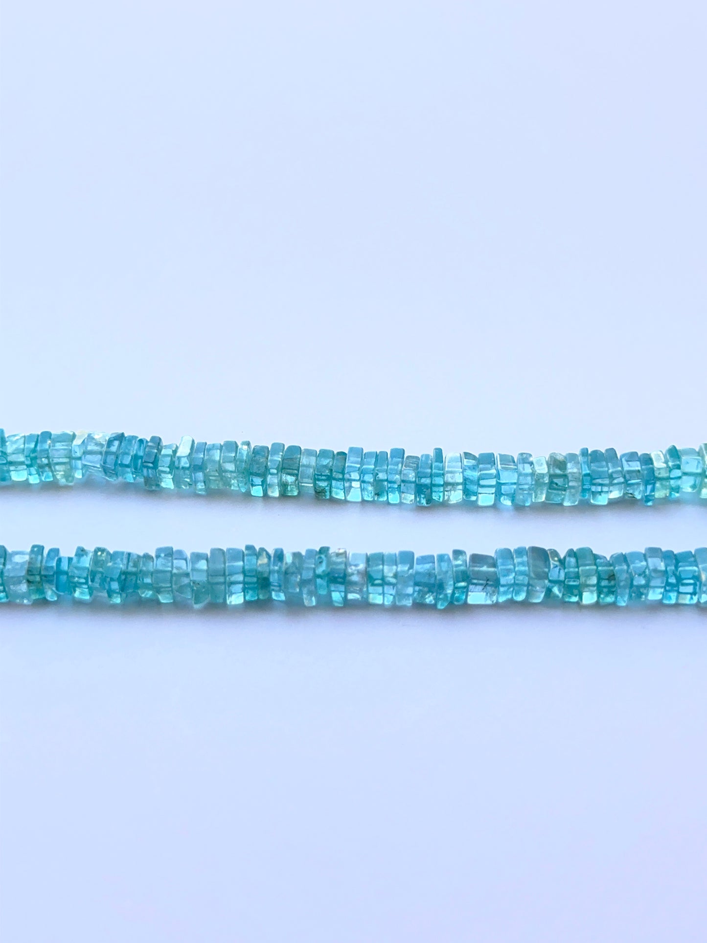 Close‑up of 4.6mm Apatite stone beads showing clean square cuts and polished surfaces ideal for natural gemstone beads for DIY jewellery.