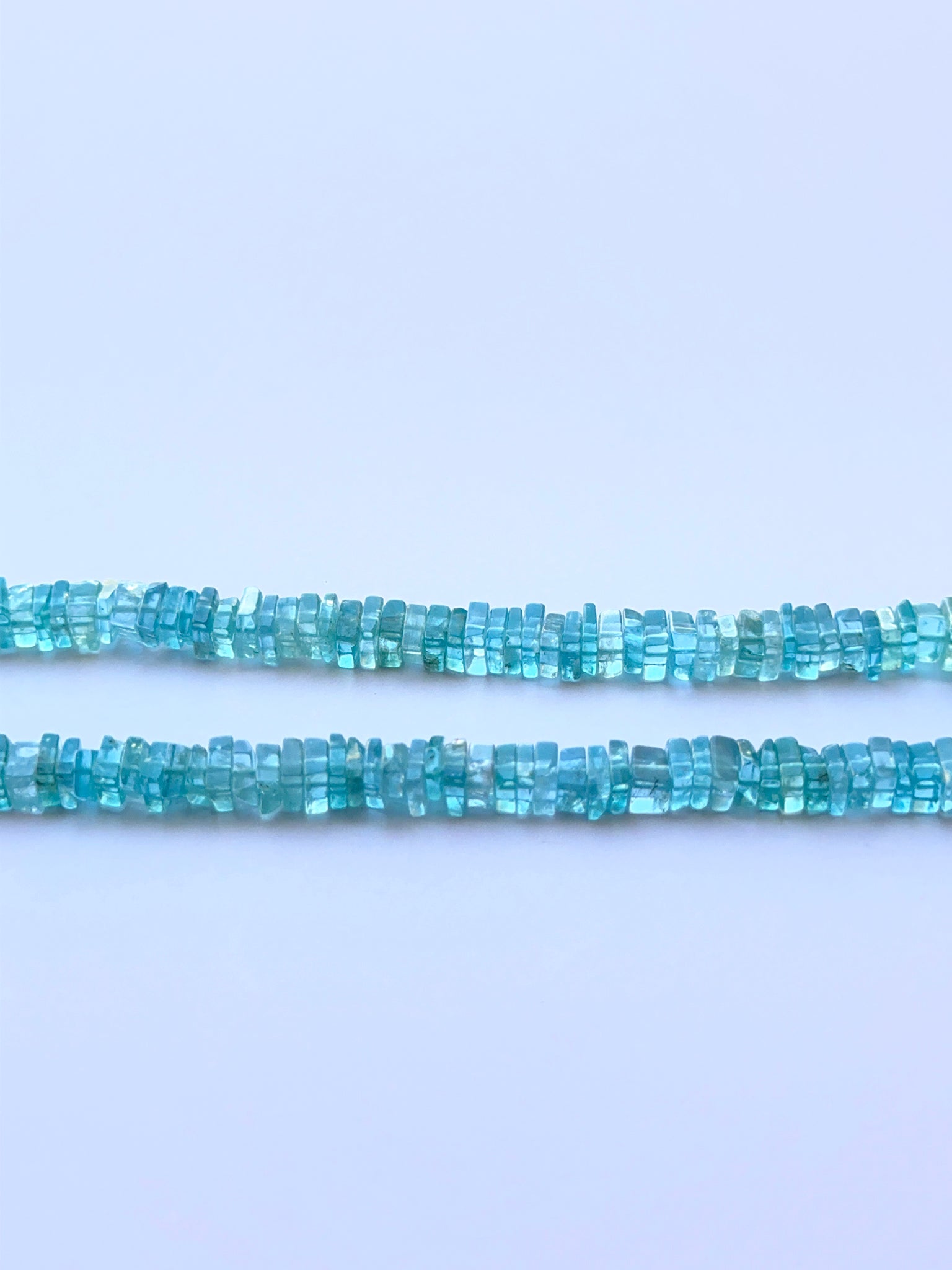 Close‑up of 4.6mm Apatite stone beads showing clean square cuts and polished surfaces ideal for natural gemstone beads for DIY jewellery.