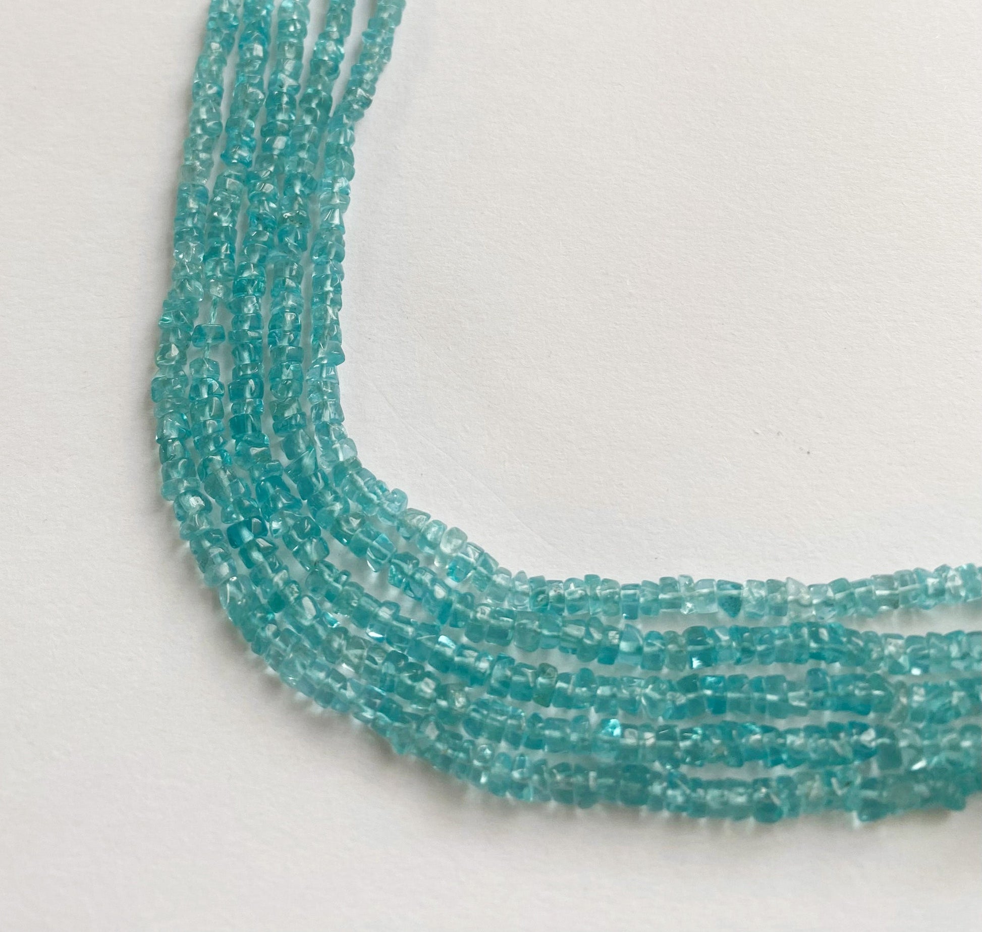 Natural Apatite gemstone beads 3.5mm featuring a smooth texture and radiant blue tones ideal for elegant jewellery designs.