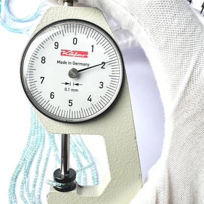 A dial gauge measures the Aquamarine faceted rondelle 2.0mm gemstone.