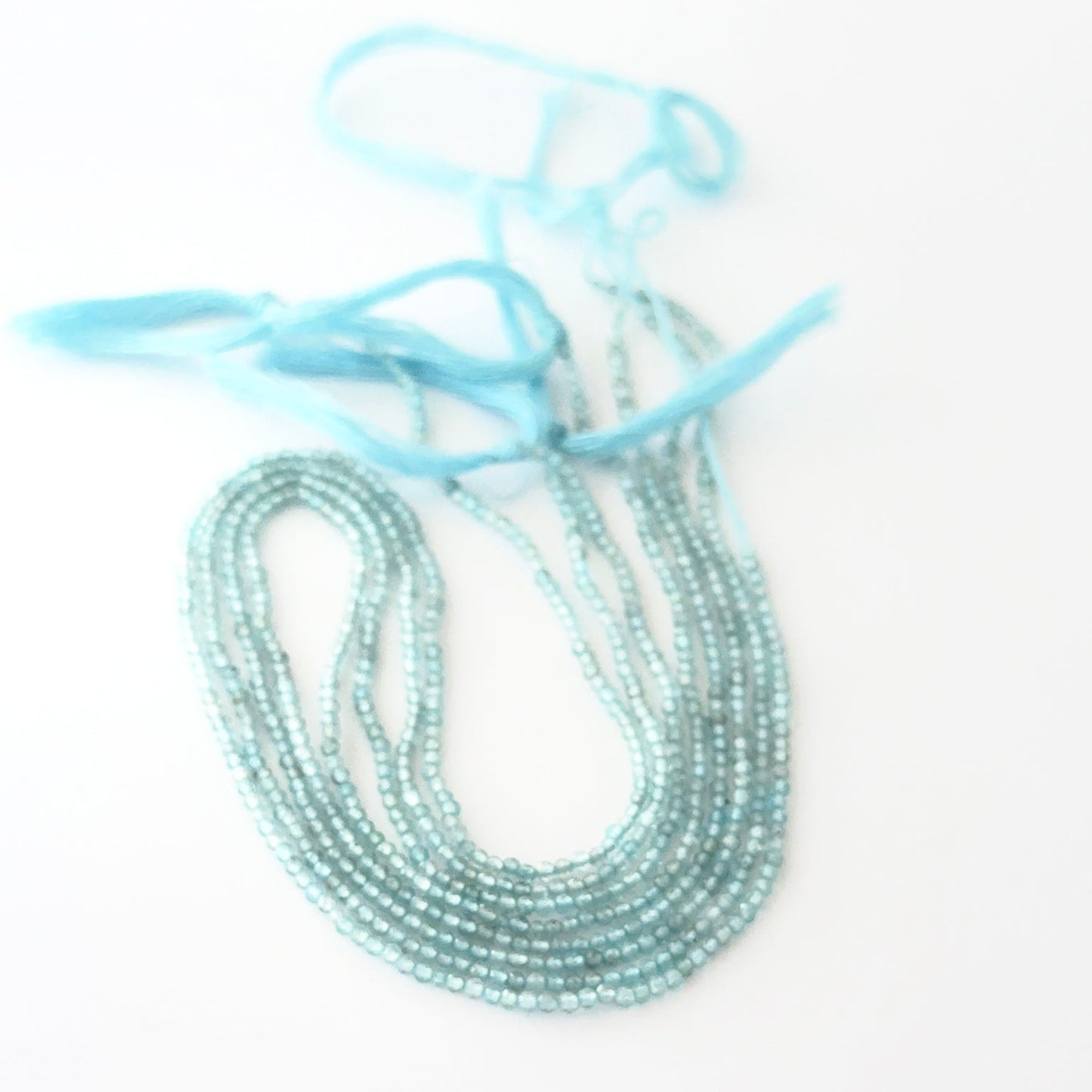 Aquamarine rondelle beads with genuine blue colour and reflective faceting for creative jewellery designs.