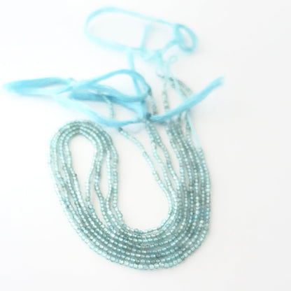Aquamarine rondelle beads with genuine blue colour and reflective faceting for creative jewellery designs.