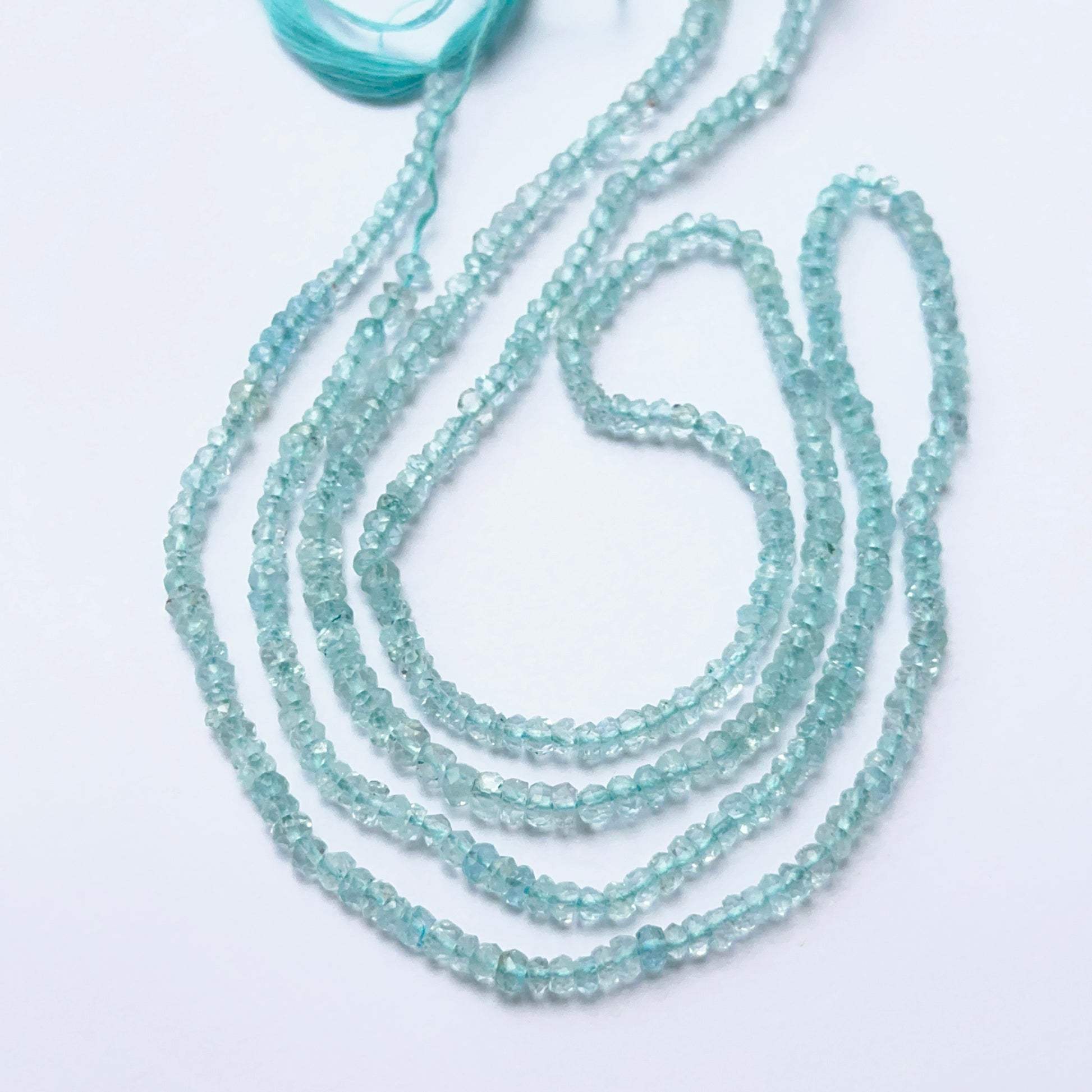 Close‑up of Lavender Opal stone beads in faceted rondelle cut, highlighting pastel tones for handmade jewellery components.