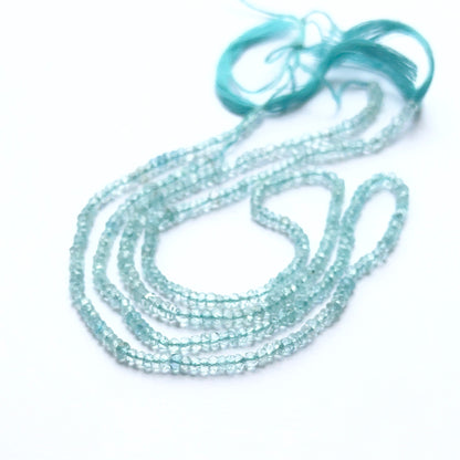 Lavender Opal 7.4–7.8mm faceted rondelle beads arranged on a strand, showing crisp faceting and gentle lavender hues.