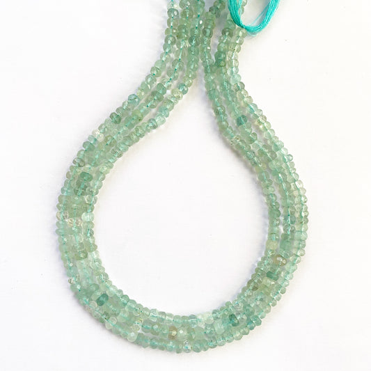 Aquamarine faceted rondelle beads in 4.5–5mm sizing with cool ocean tones and radiant clarity.