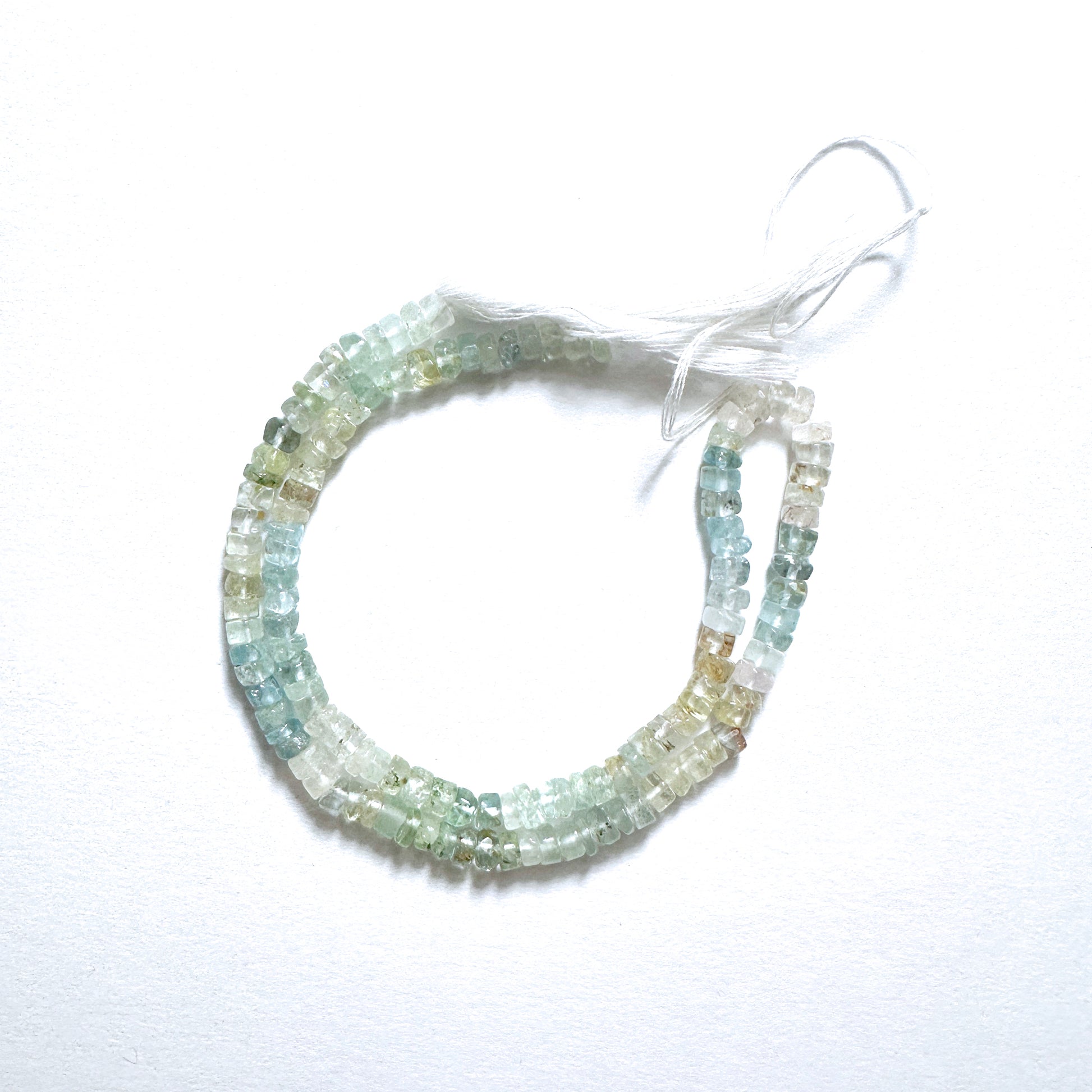 Natural gemstone beads in aquamarine blue, smooth wheel cut, 4.5-4.8mm, perfect for DIY jewellery and elegant designs.