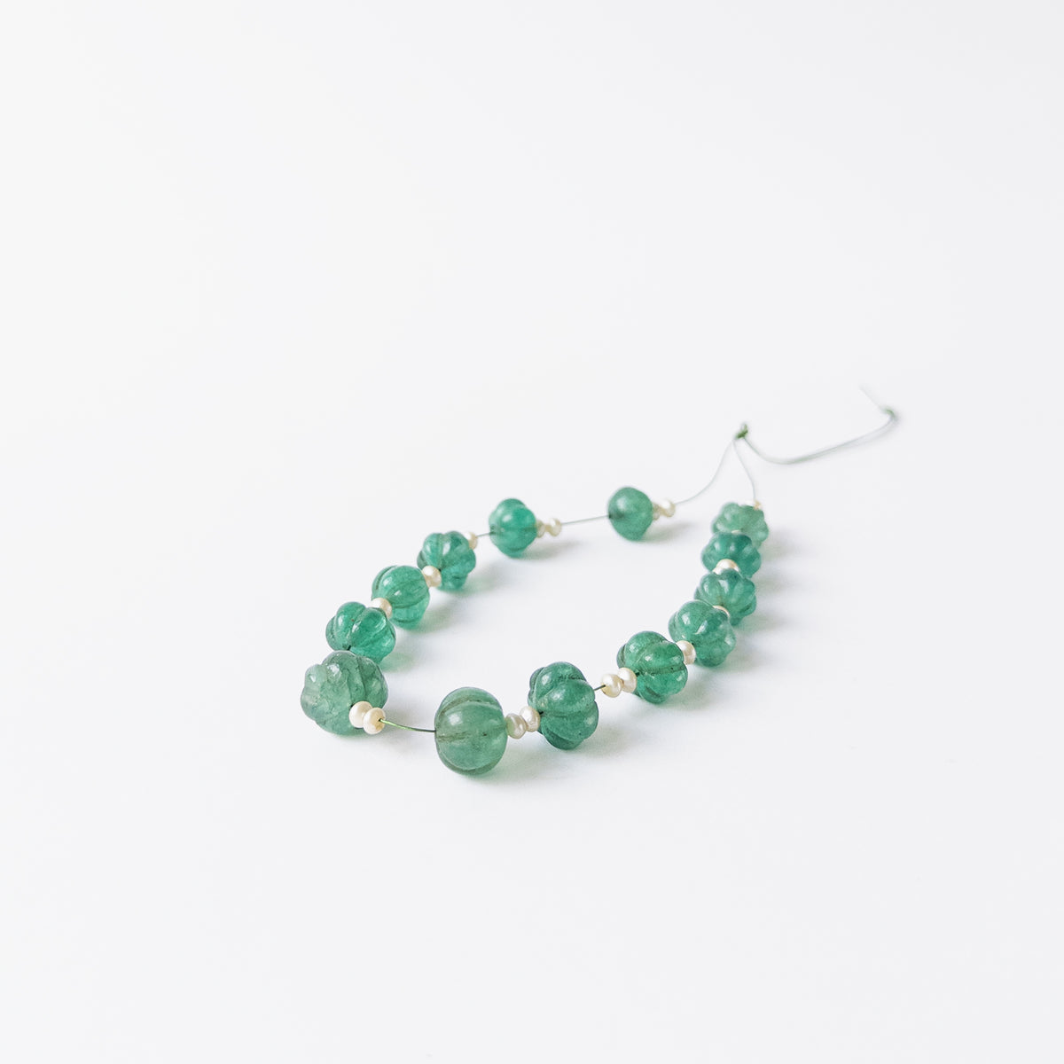 Genuine Beryl and Shell Pearl beads in pumpkin cut design with polished grooves and soft colour.