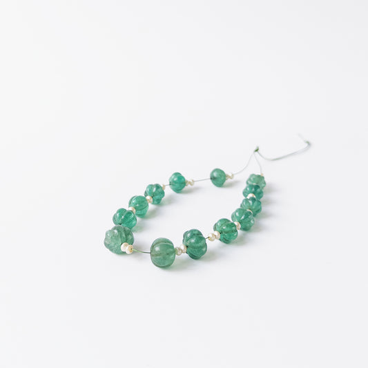 Genuine Beryl and Shell Pearl beads in pumpkin cut design with polished grooves and soft colour.
