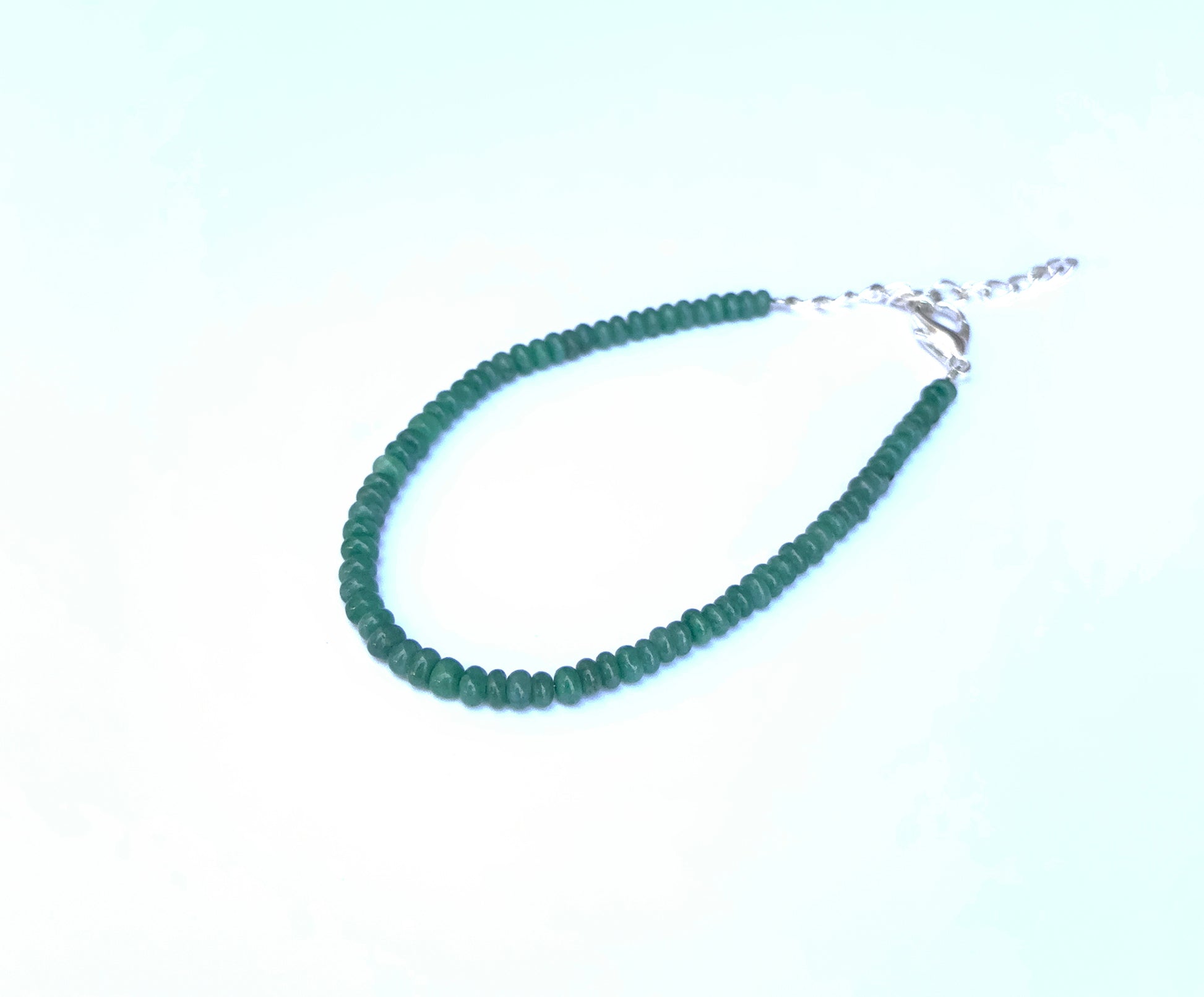 Handcrafted Beryl bracelet showcasing smooth rondelle beads and radiant shine.