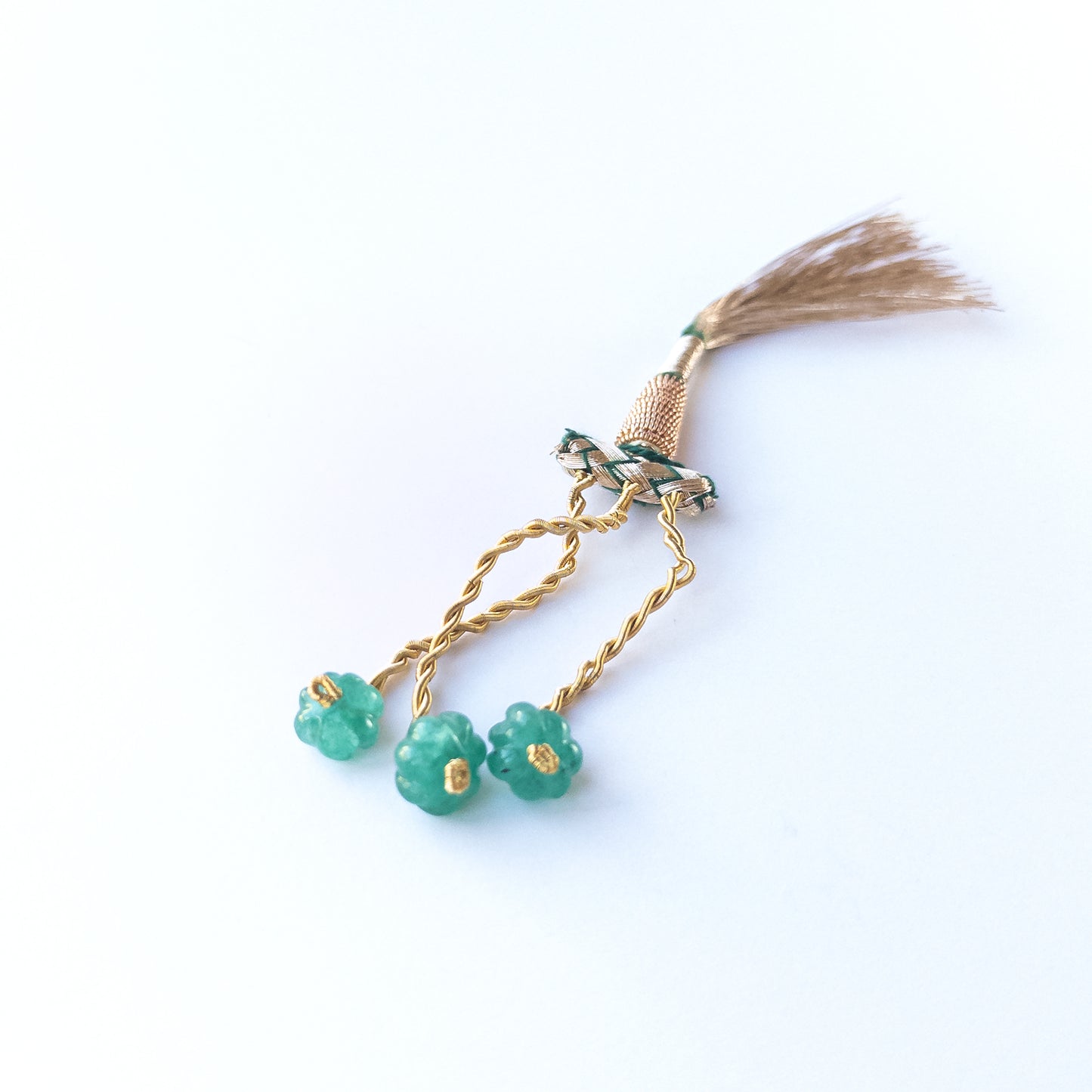 Close‑up of genuine Beryl pumpkin‑cut beads highlighting their shine, clarity and rounded carved form.