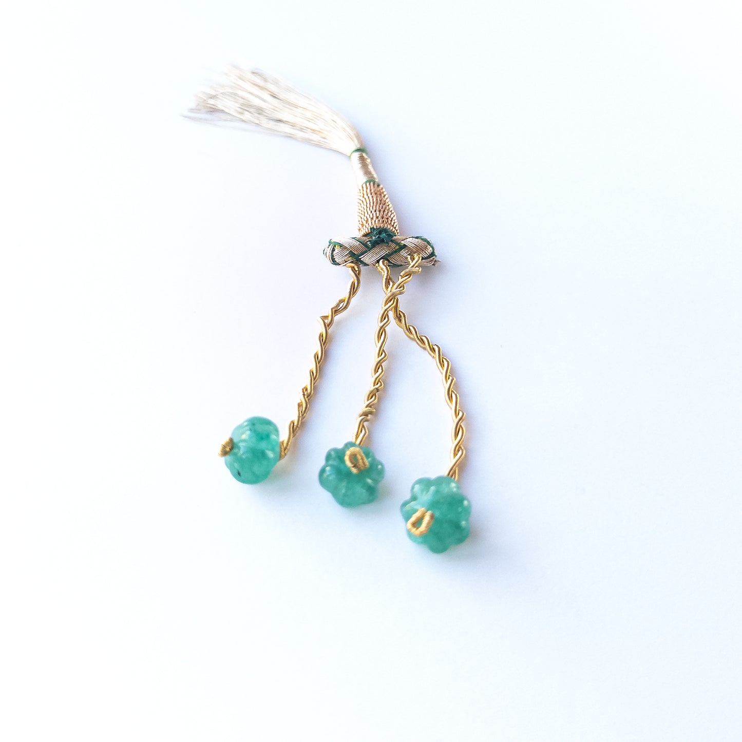 Natural Beryl pumpkin‑cut stones displaying soft multicolour hues and carved ridged shapes.