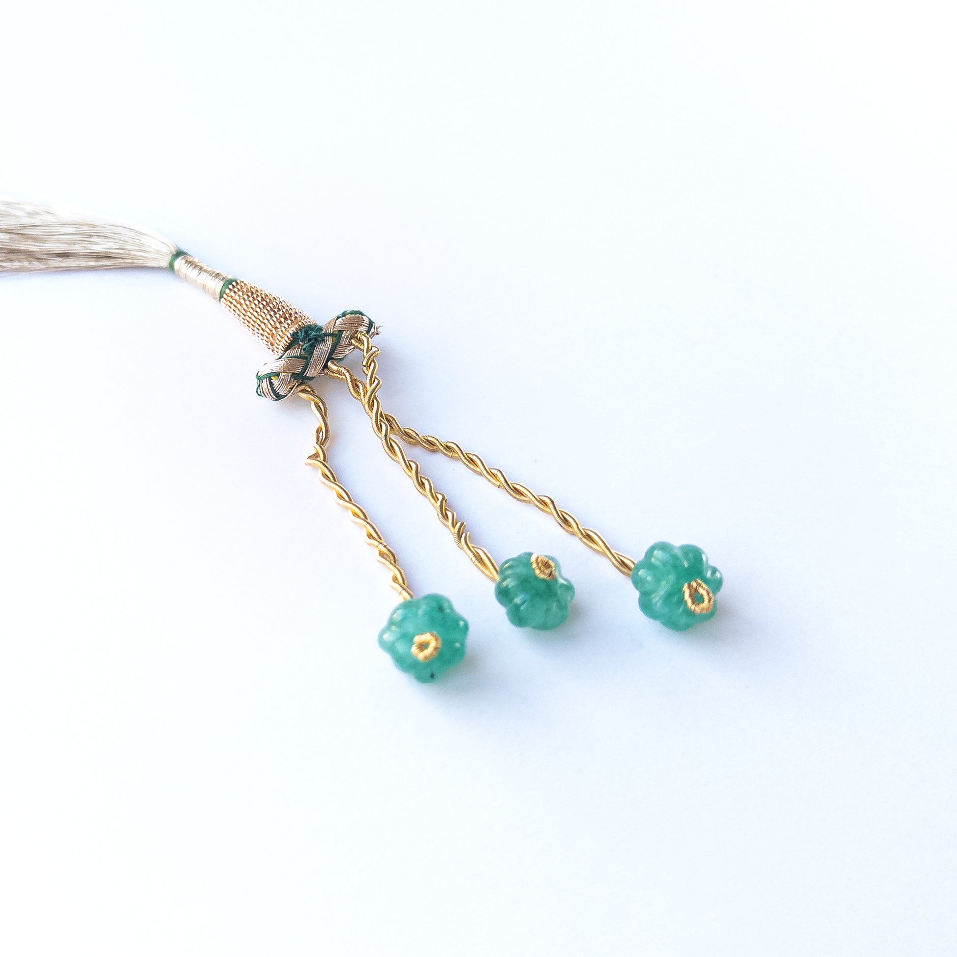 Beryl pumpkin‑cut beads, showing their carved shape and natural shimmer.