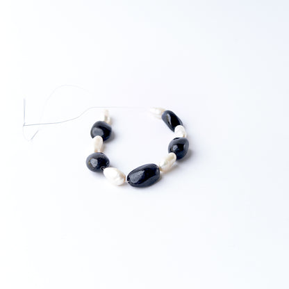 Genuine gemstone beads combining polished Black Sapphire with luminous Freshwater Pearls in a premium bead selection.