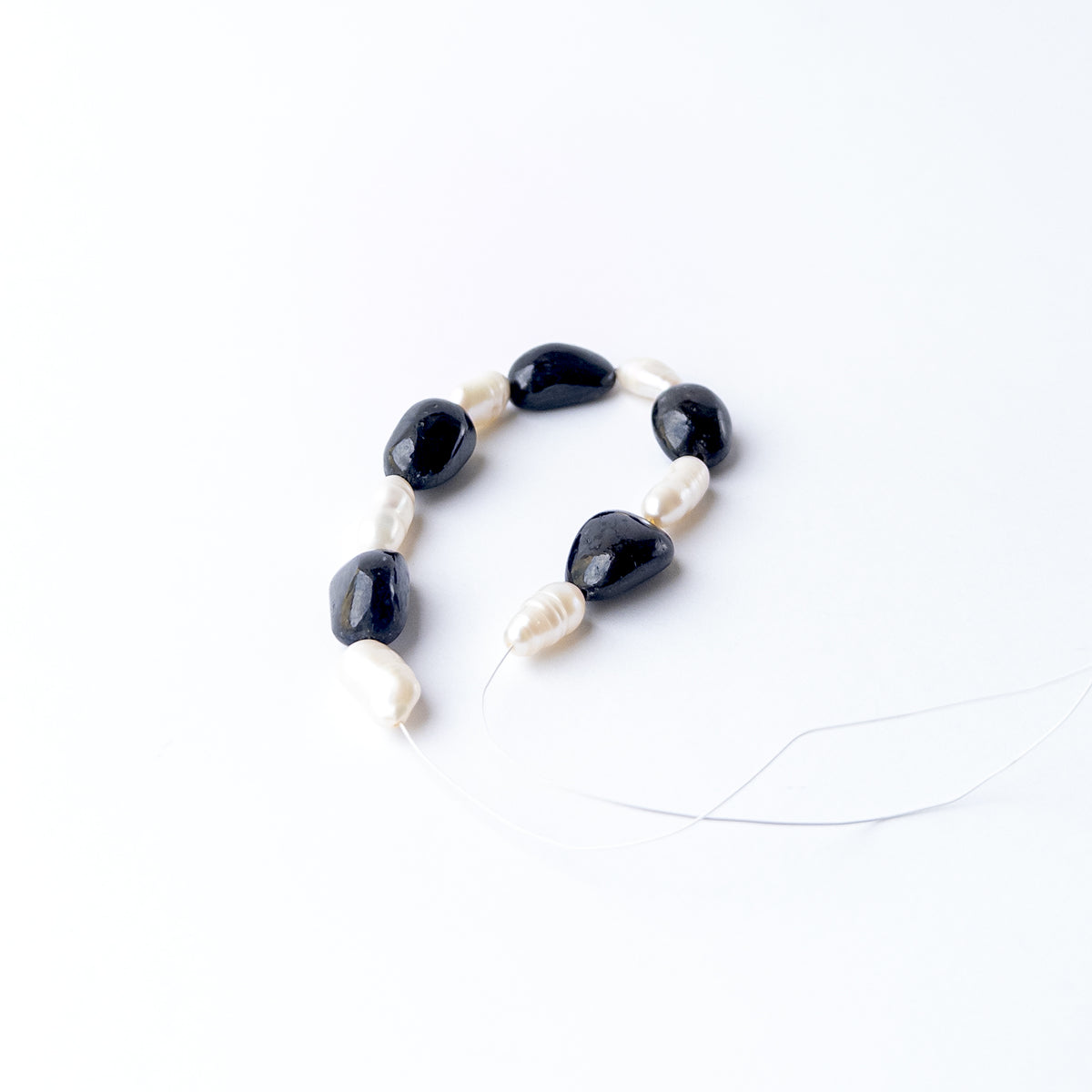 Black Sapphire and Freshwater Pearl gemstone beads for DIY jewellery offering timeless sophistication and natural beauty.