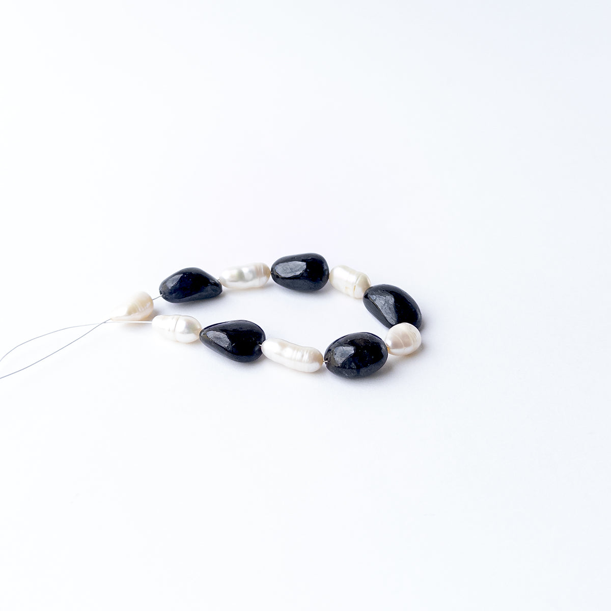 Authentic Black Sapphire and Freshwater Pearl stone beads with smooth tumble shapes for elegant jewellery creations.