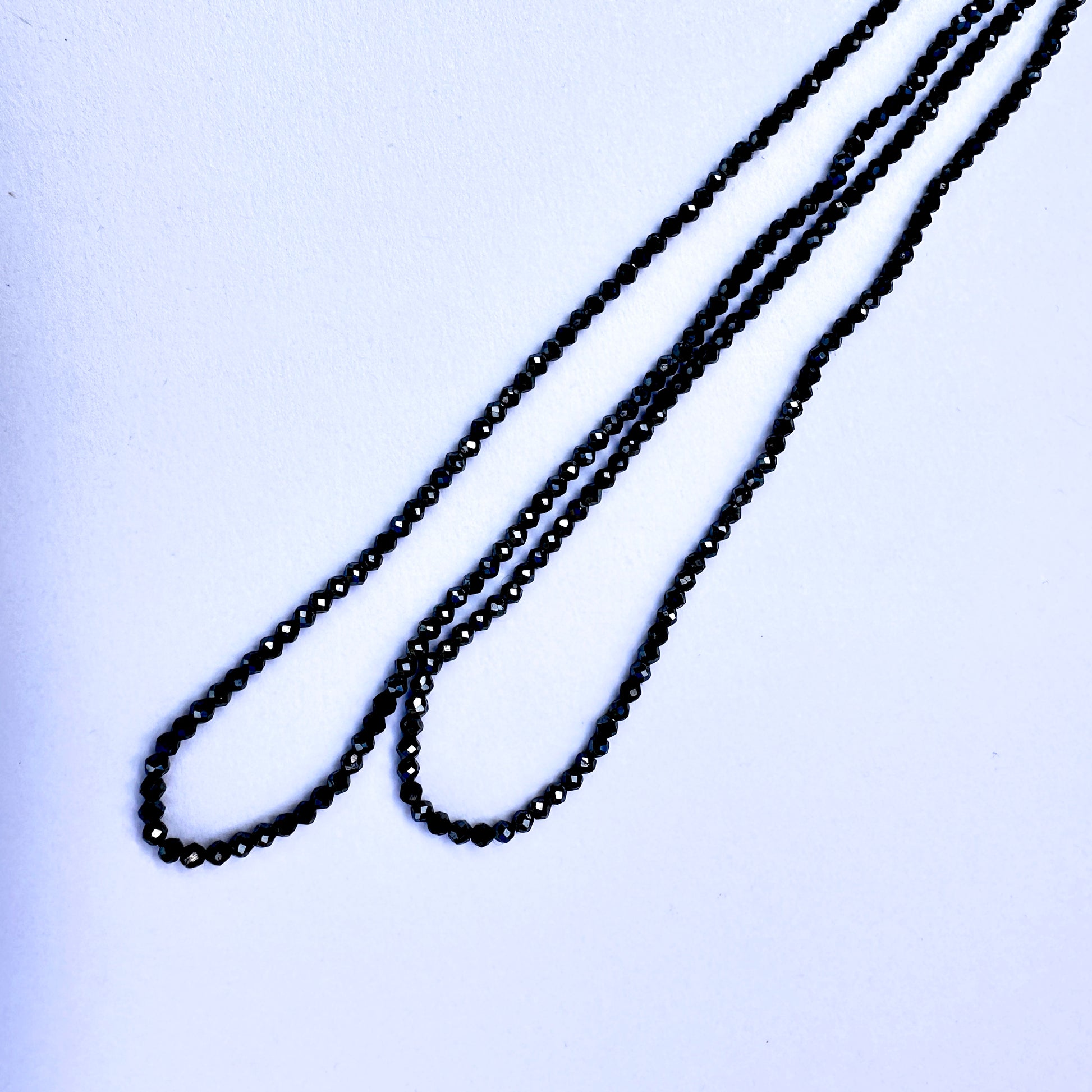 Natural gemstone beads in coated Black Spinel, 2.1mm size, ideal for elegant DIY jewellery designs.