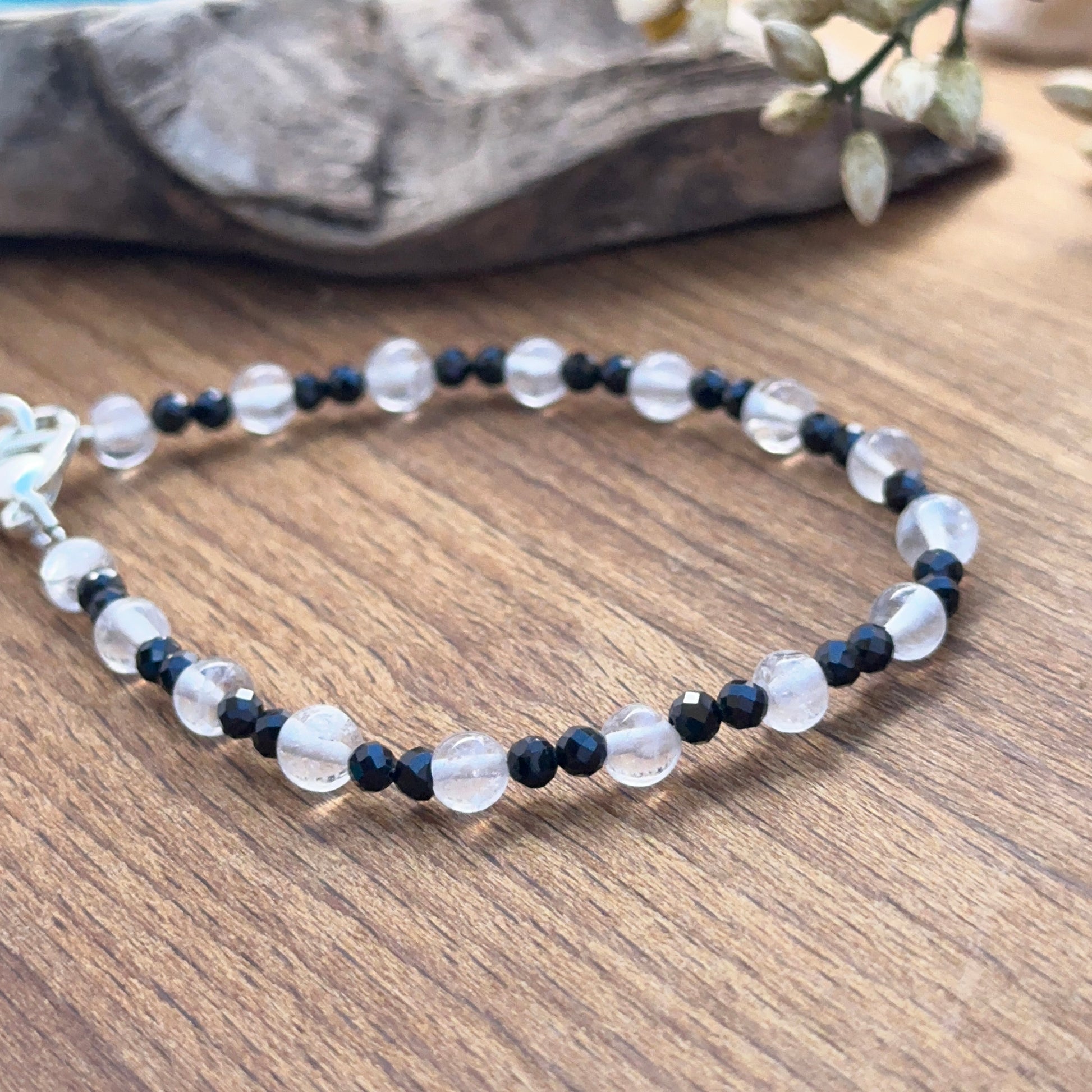 Black spinel and crystal bracelet photographed to show clarity, shine and refined gemstone beauty.