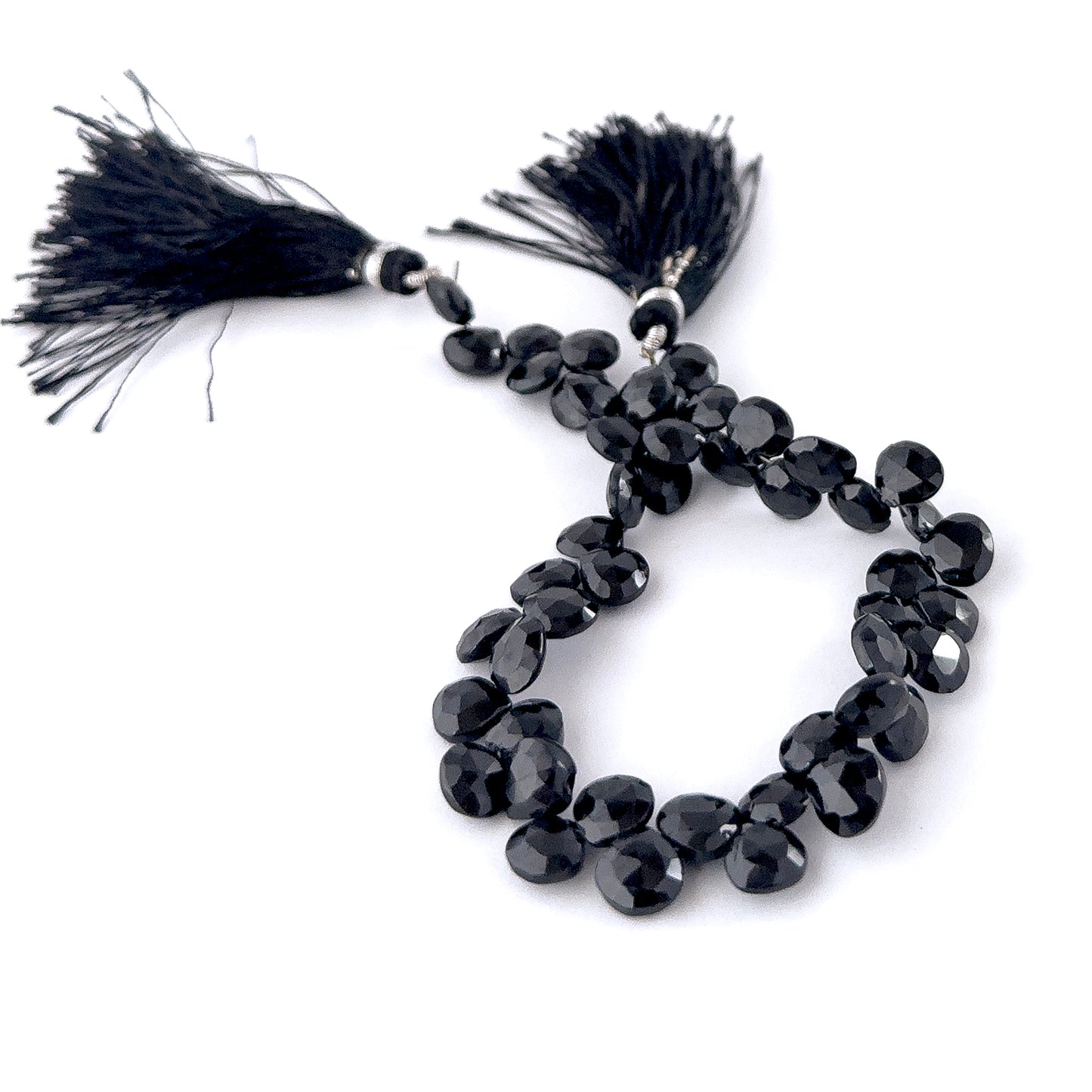 Black Spinel faceted briolette beads sized 7.5–8mm arranged in a 21cm strand, showing deep jet‑black tones and sharp reflective sparkle across 46 pieces.
